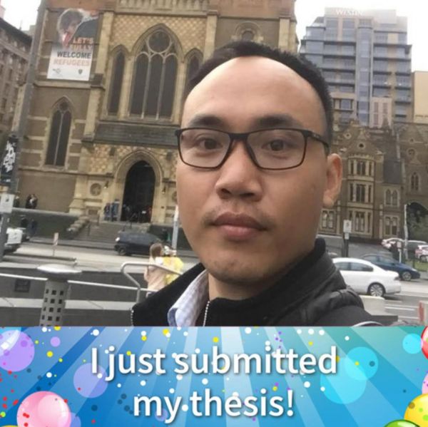 Graduate researcher posing for thesis submission photo