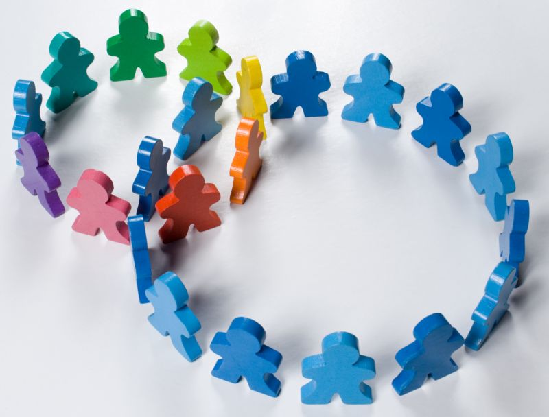 Multicolored wooden people illustrating a business concept - networking or teamwork
